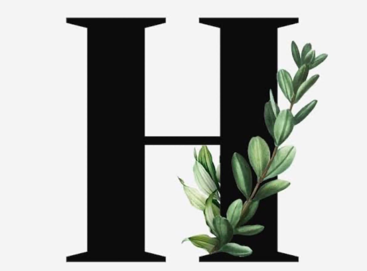 A black serif letter H with a green leafy branch entwined on the right.